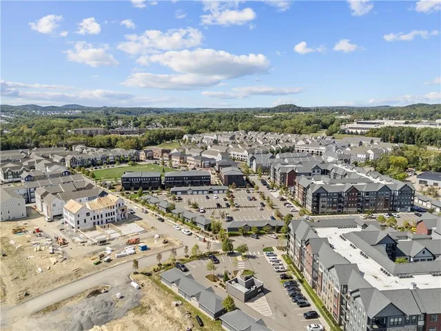 a view of a swimming pool with seating space