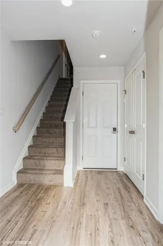 a view of entryway with wooden floor