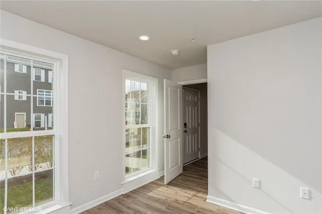 a view of hallway with windows and entryway
