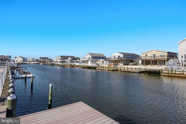 a view of a lake with outdoor seating