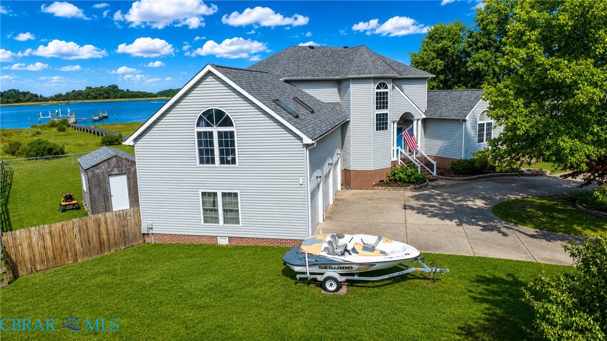 1214 Dandy Loop Road Yorktown, VA 23692 - Photo 10 of 65 a front view of a house with a garden