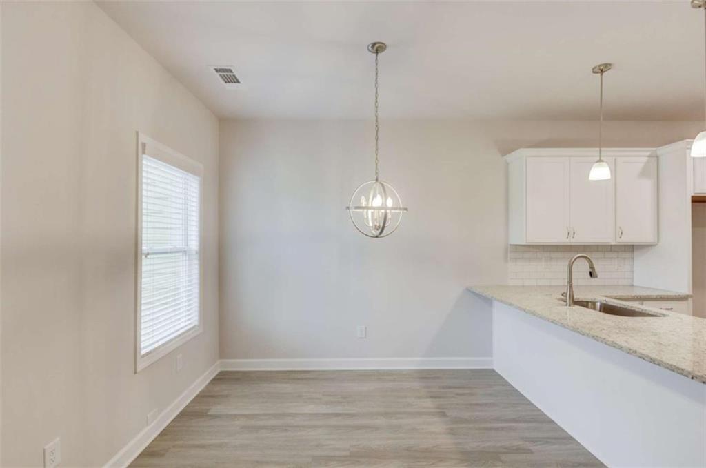 6342 Pine Ridge Point Lula, GA 30554 - Photo 9 of 27 a bathroom with a sink and a mirror
