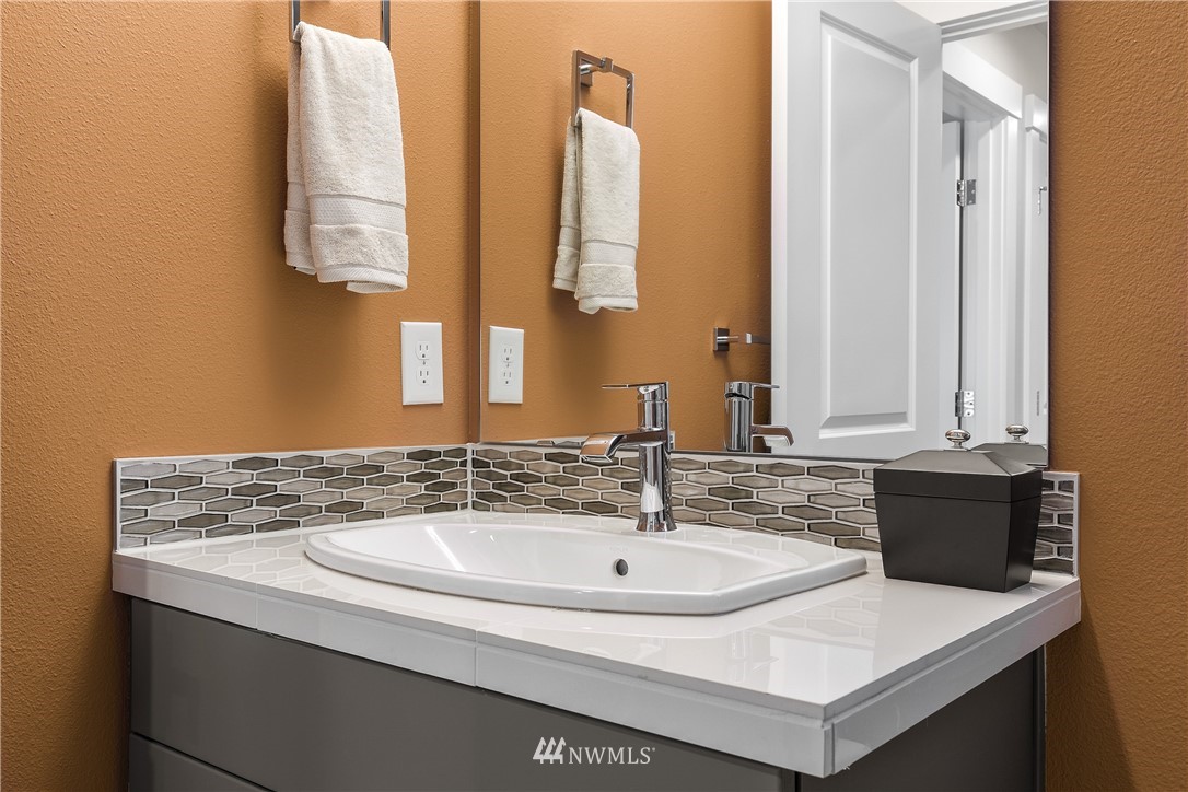 23118 88th Avenue West, Unit 3 Edmonds, WA 98026 - Photo 13 of 31 a bathroom with a sink and a mirror