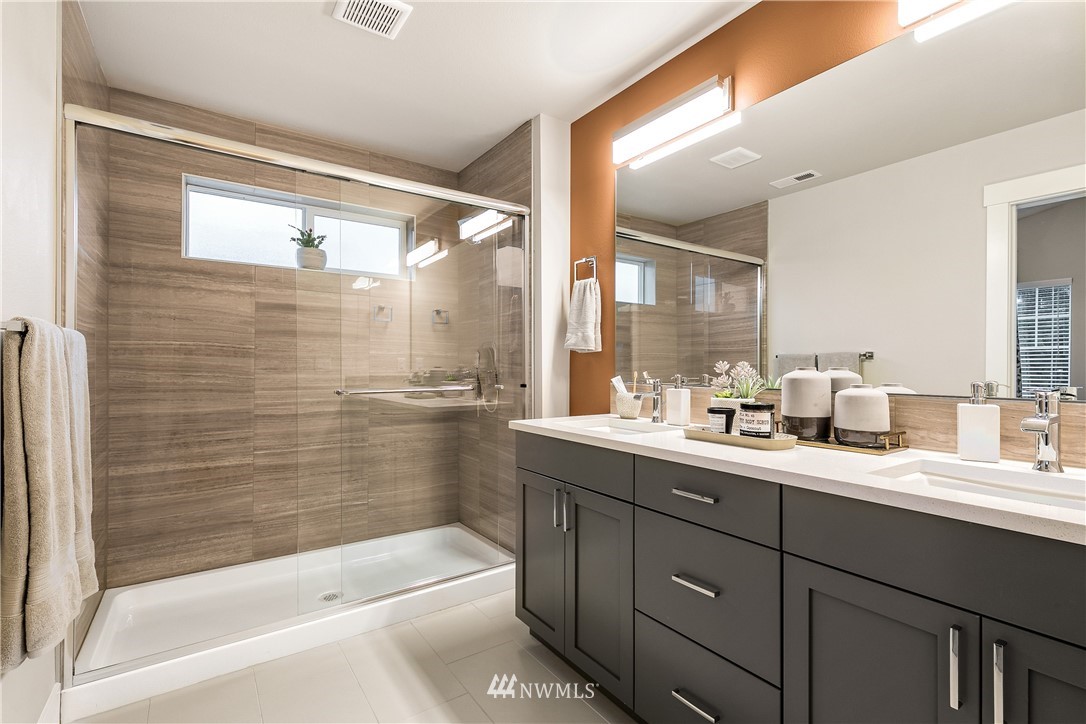23118 88th Avenue West, Unit 3 Edmonds, WA 98026 - Photo 28 of 31 a bathroom with a bathtub shower sink vanity and mirror
