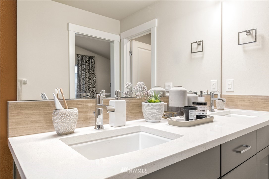 23118 88th Avenue West, Unit 3 Edmonds, WA 98026 - Photo 29 of 31 a kitchen with a sink and a mirror