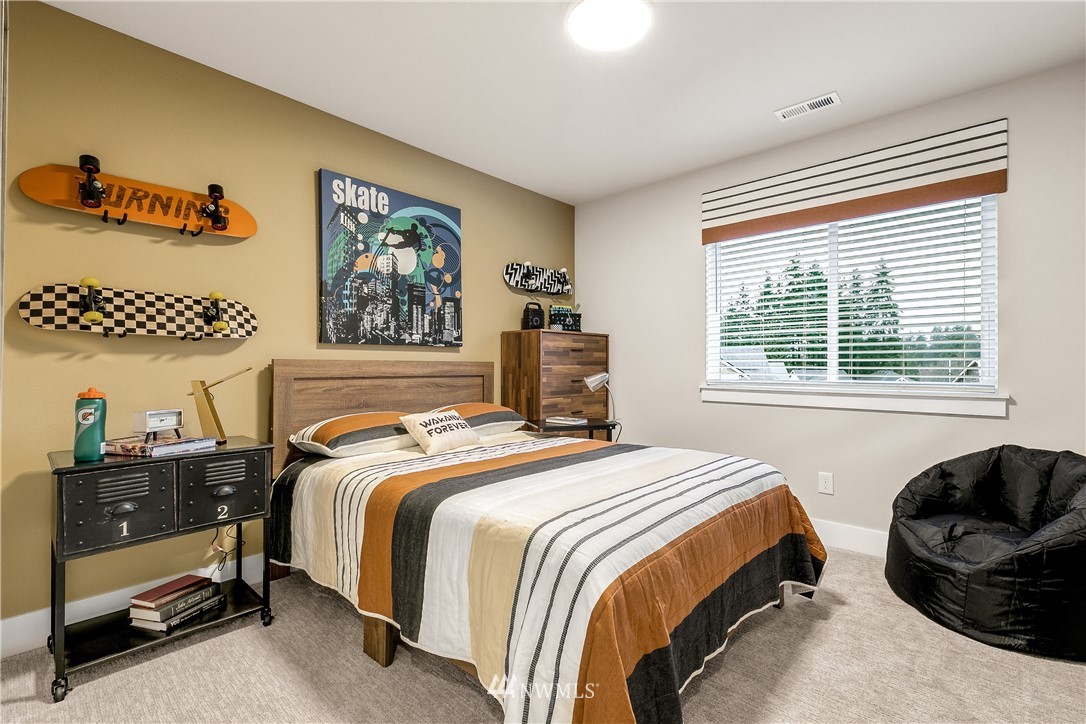 23118 88th Avenue West, Unit 3 Edmonds, WA 98026 - Photo 30 of 31 a bedroom with a bed and a window