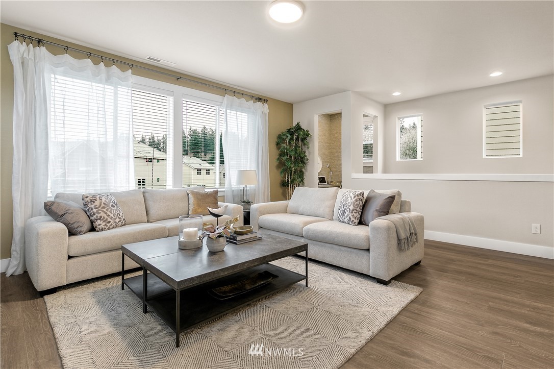 23118 88th Avenue West, Unit 3 Edmonds, WA 98026 - Photo 5 of 31 a living room with furniture and a large window