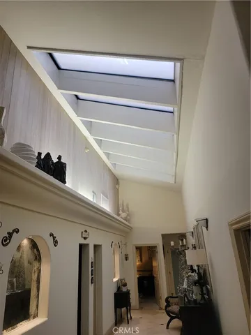 a bathroom with a double vanity sink toilet and mirror