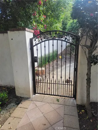 a bed room with a bed and a chandelier