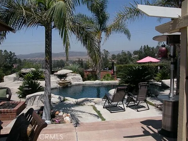 a view of swimming pool with a sitting space