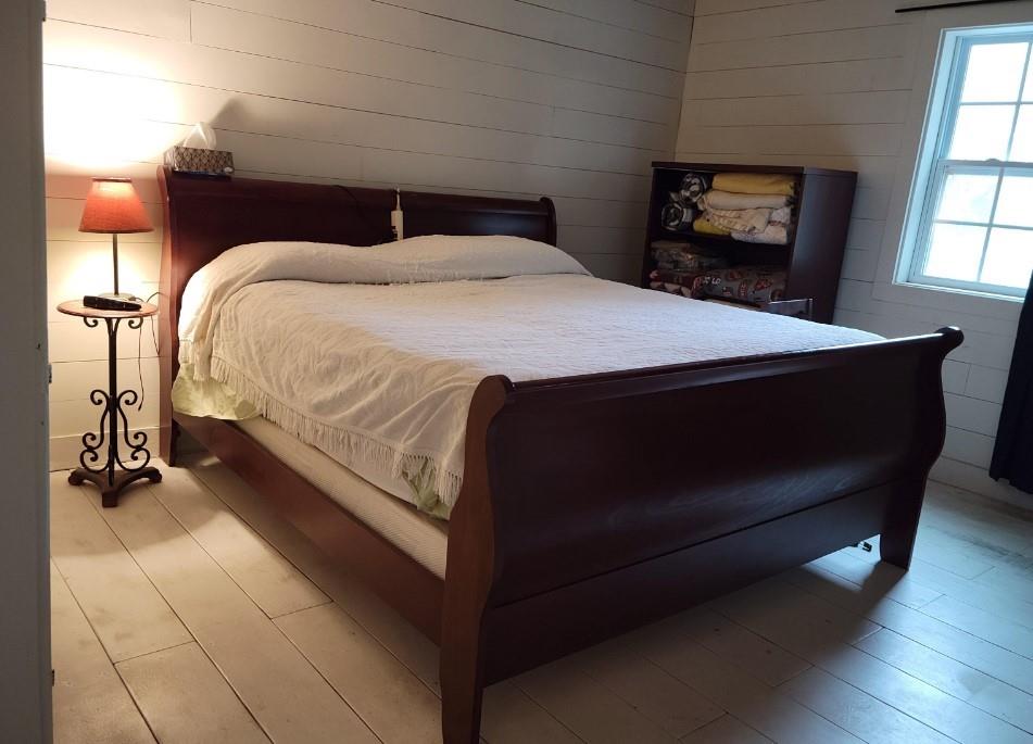 97 Sycamore Street Rockmart, GA 30153 - Photo 6 of 7 a bedroom with a bed and wooden floor