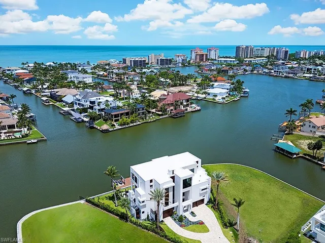 an aerial view of a house with a lake view