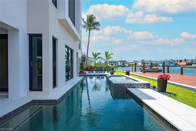 a view of swimming pool with seating area