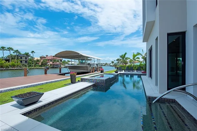 a view of swimming pool with seating area