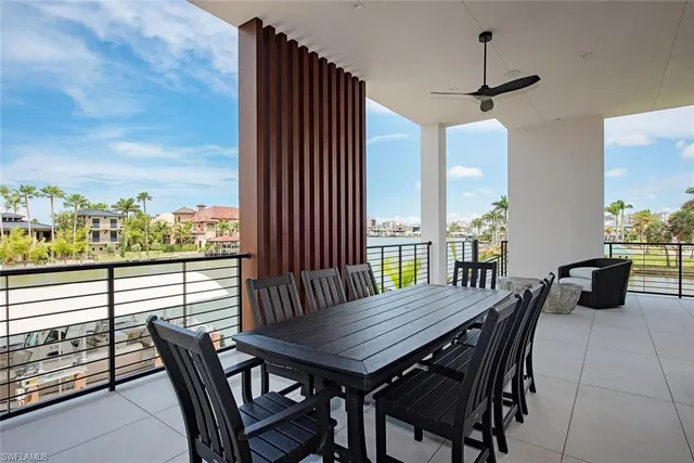 a view of a roof deck with furniture