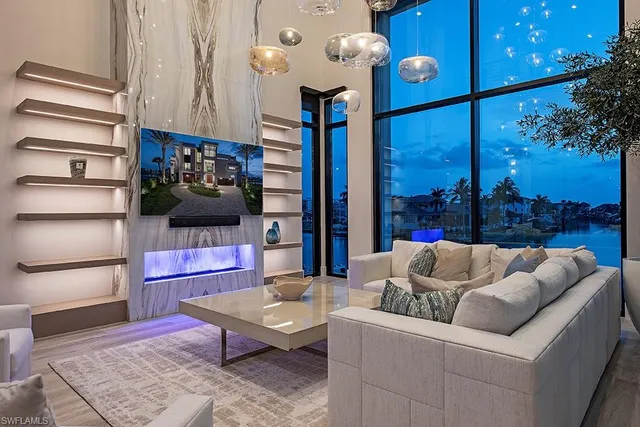 a living room with furniture cabinets and a flat screen tv