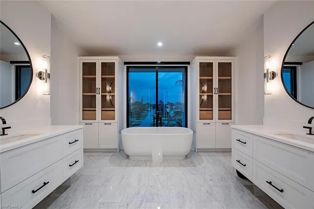 a spacious bathroom with a bathtub and a window