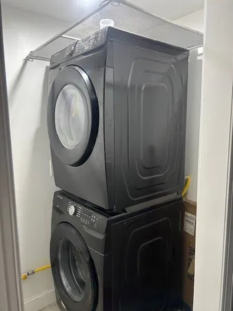 a close up view of a washer and dryer in a utility room