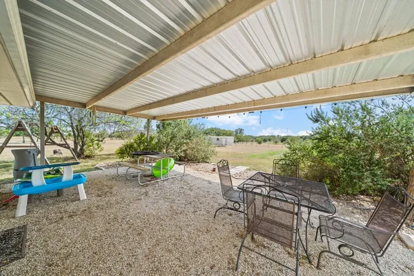 a view of sitting area with furniture and garden view