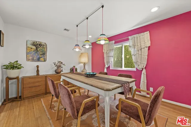 a view of a dining room with furniture and window