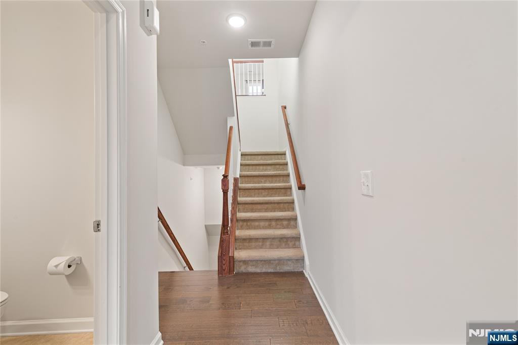 43 Wesmont Drive, Unit 1712 Wood-Ridge, NJ 07075 - Photo 11 of 35 a view of entryway and hall with wooden floor