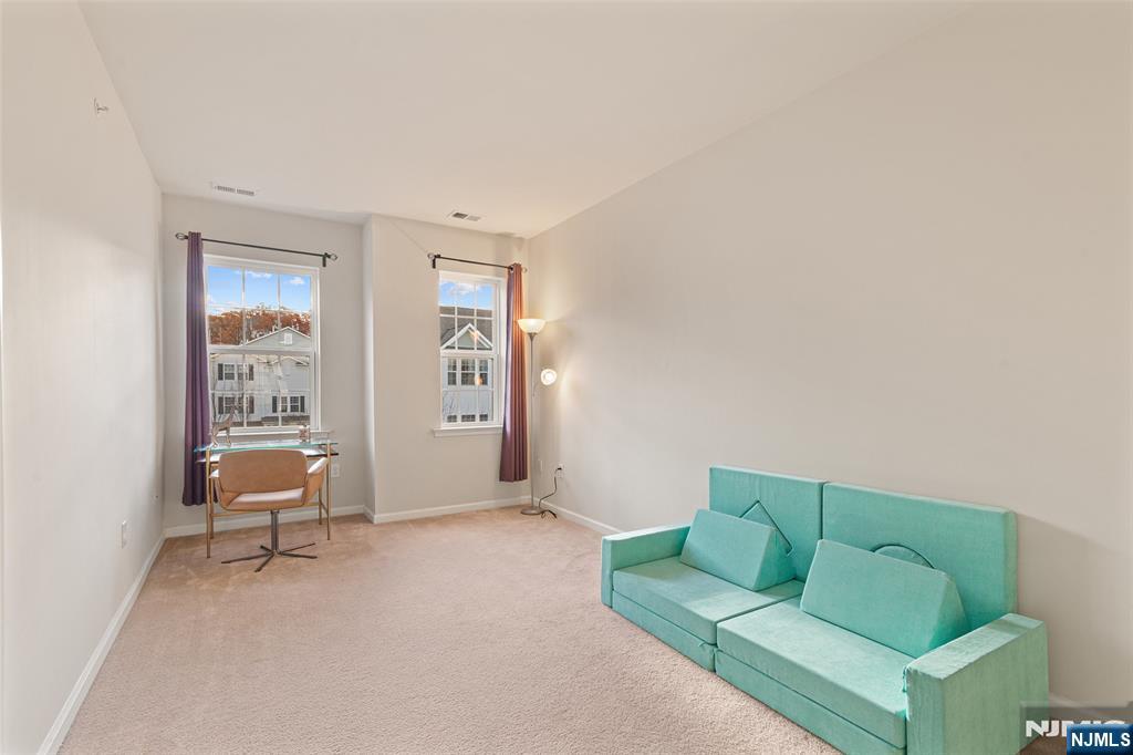 43 Wesmont Drive, Unit 1712 Wood-Ridge, NJ 07075 - Photo 16 of 35 a living room with furniture and a window
