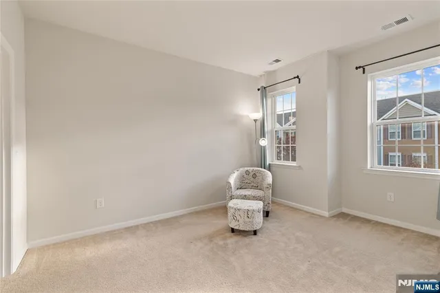 a room with a chair and a window