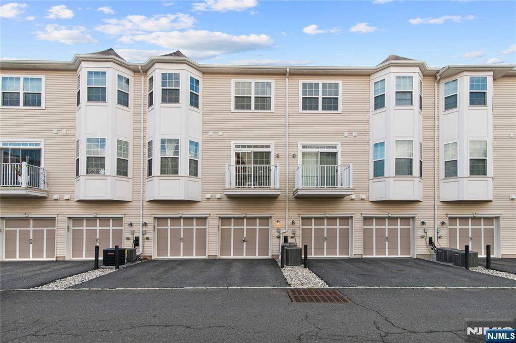 43 Wesmont Drive, Unit 1712 Wood-Ridge, NJ 07075 - Photo 22 of 35 a view of building with windows