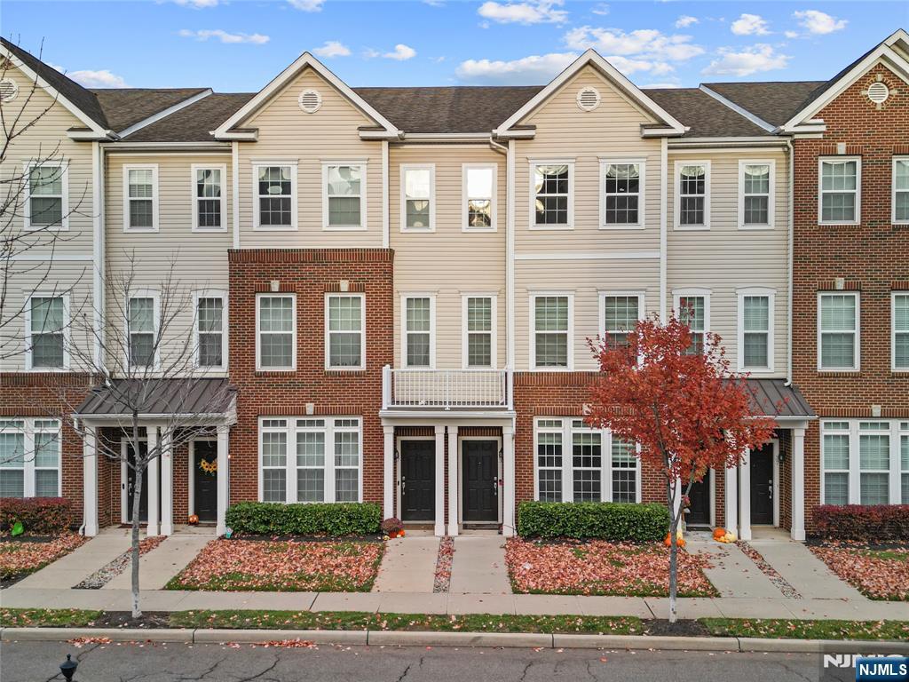 43 Wesmont Drive, Unit 1712 Wood-Ridge, NJ 07075 - Photo 24 of 35 a front view of a house with a yard