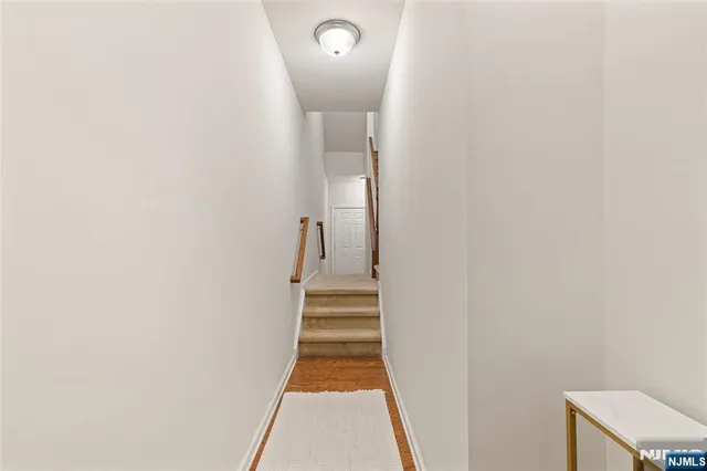 a view of a hallway with staircase