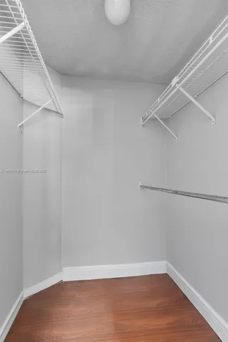 a view of an empty walk in closet
