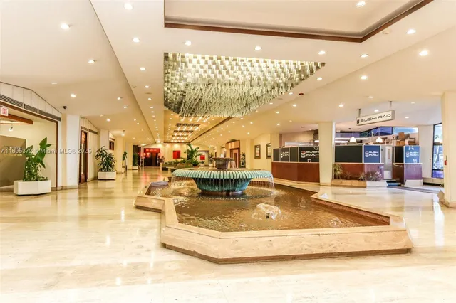 a view of a lobby with furniture and a large mirror