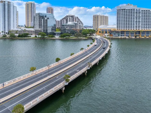 a view of a city with a lake