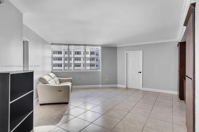 a view of an empty room with a window