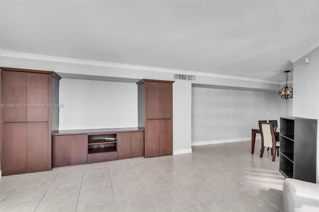 a spacious bathroom with a sink and a refrigerator