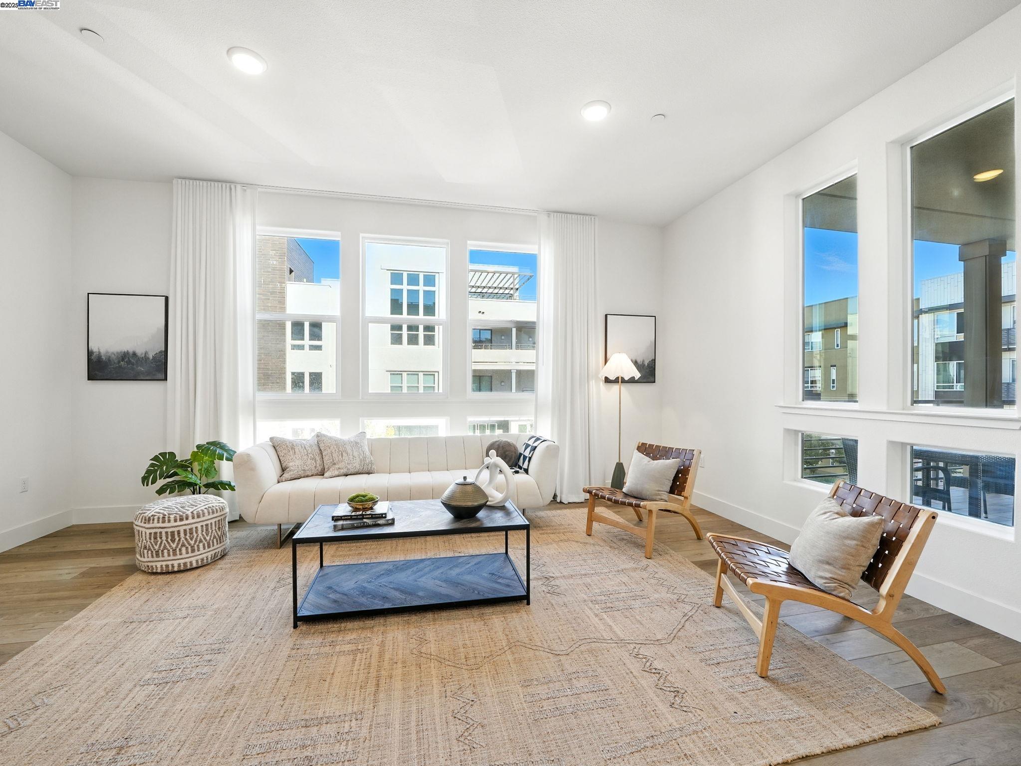 a living room with furniture and windows
