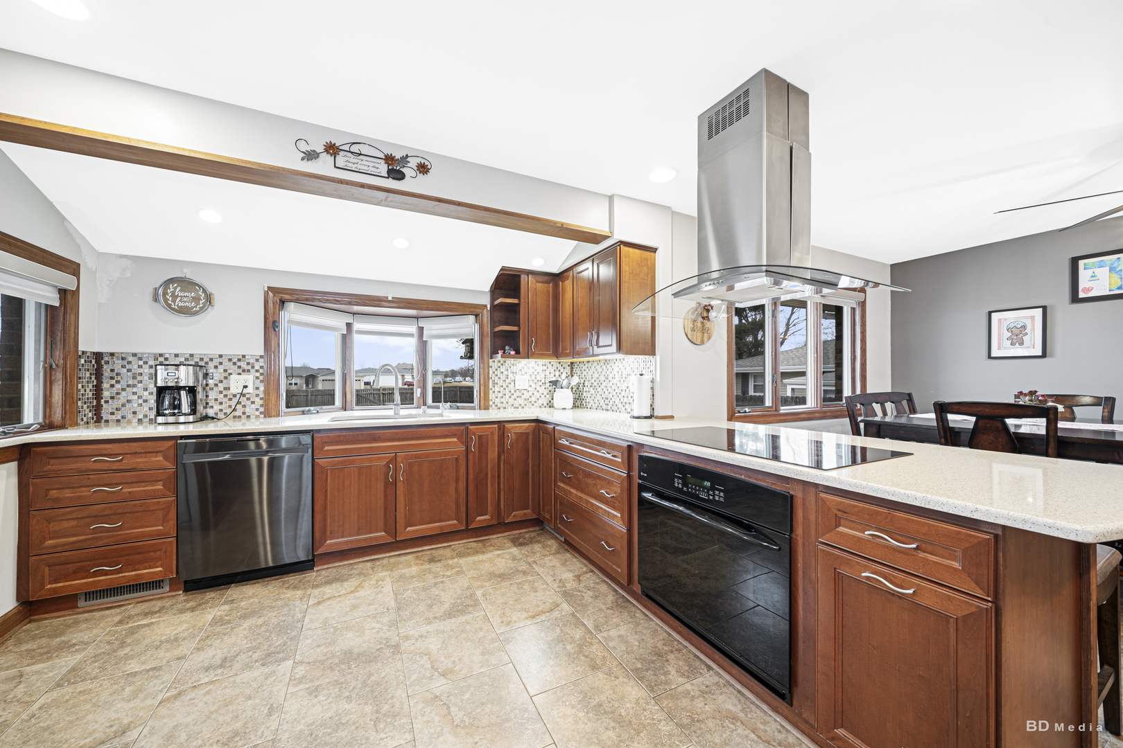 807 Maple Lane Peotone, IL 60468 - Photo 14 of 33 a large kitchen with stainless steel appliances granite countertop a sink and cabinets