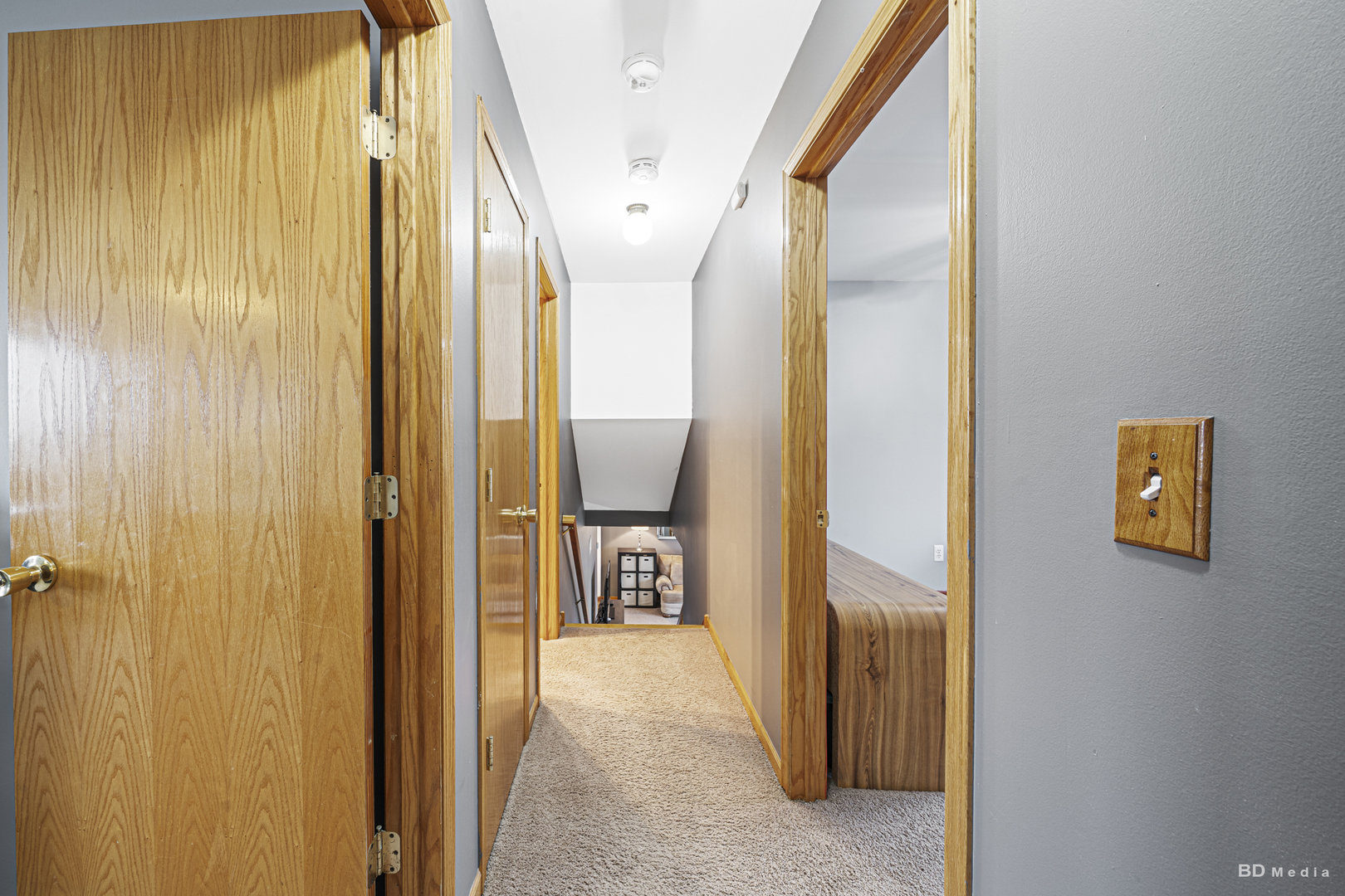 807 Maple Lane Peotone, IL 60468 - Photo 19 of 33 a view of a hallway with wooden floor and staircase