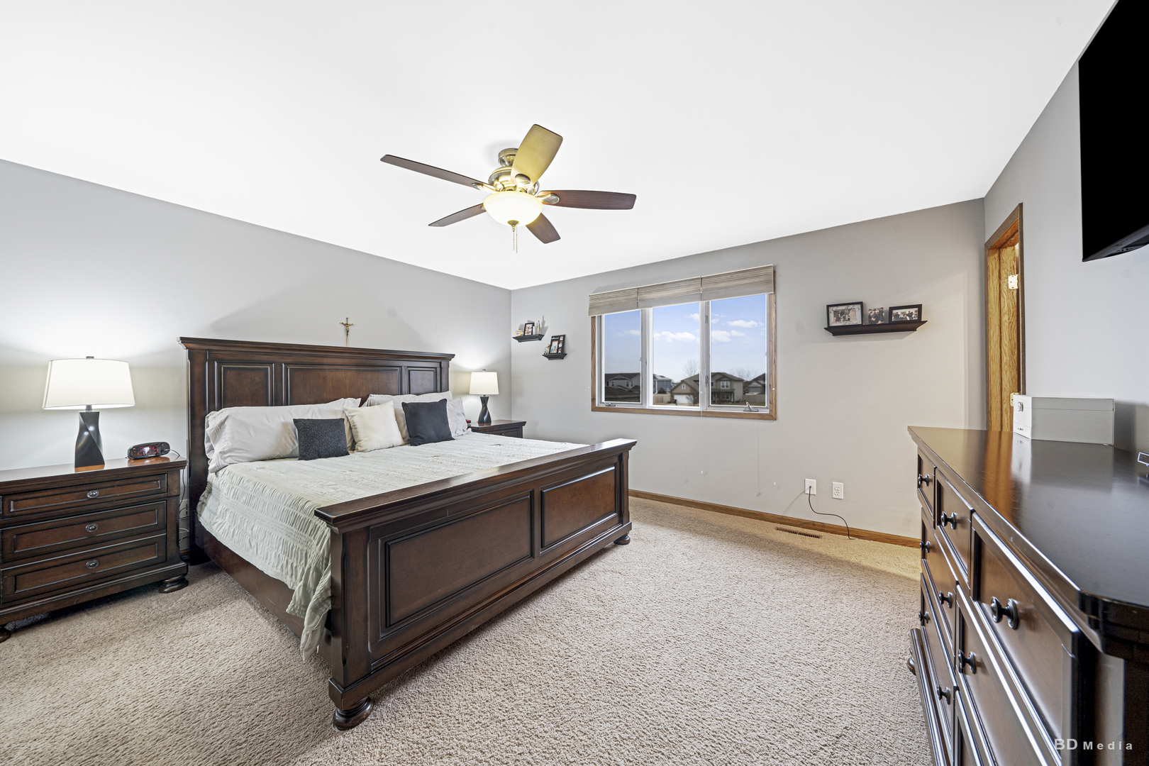 807 Maple Lane Peotone, IL 60468 - Photo 20 of 33 a spacious bedroom with a bed and a flat screen tv