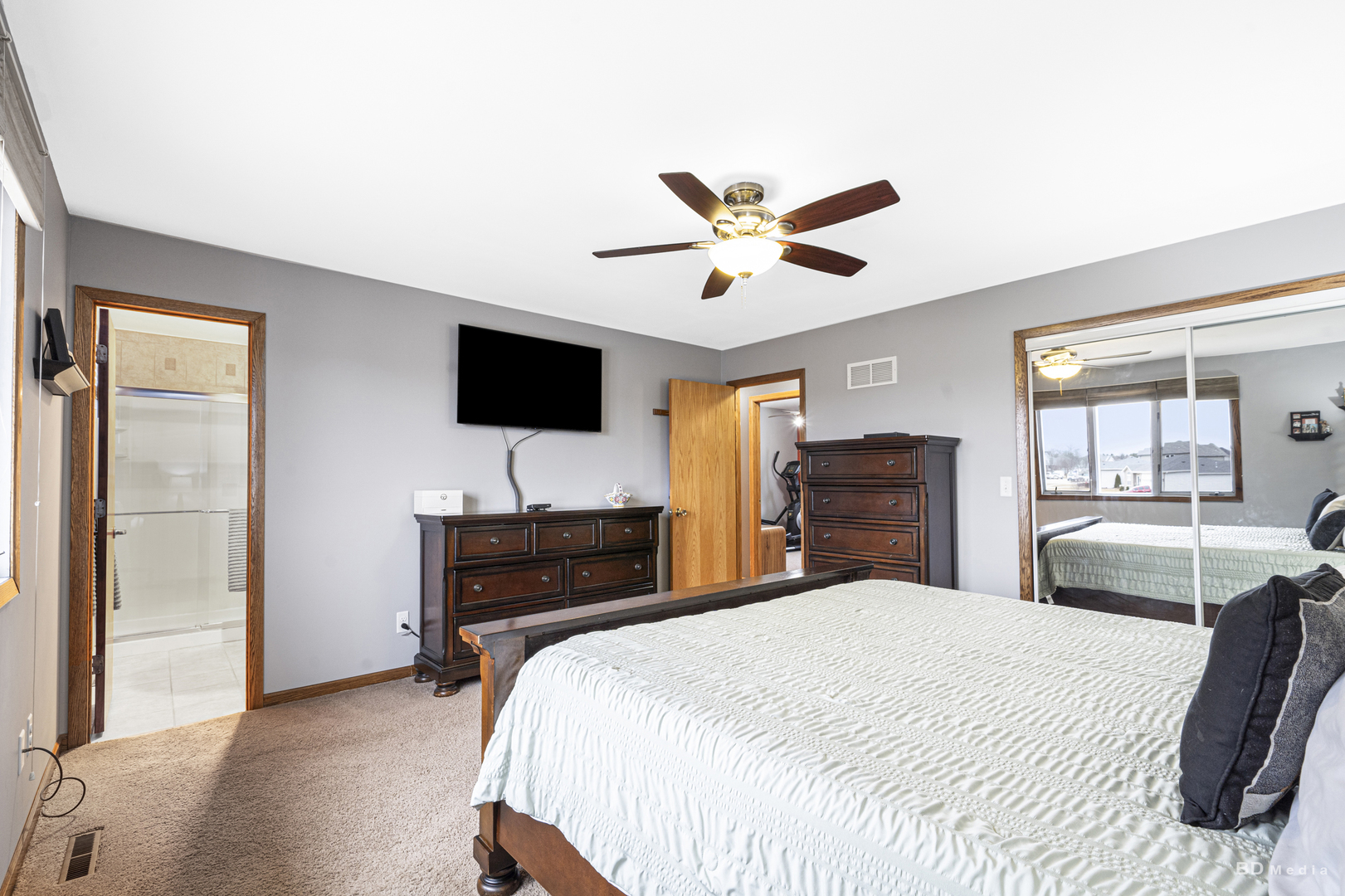 807 Maple Lane Peotone, IL 60468 - Photo 21 of 33 a bedroom with a bed and a flat screen tv