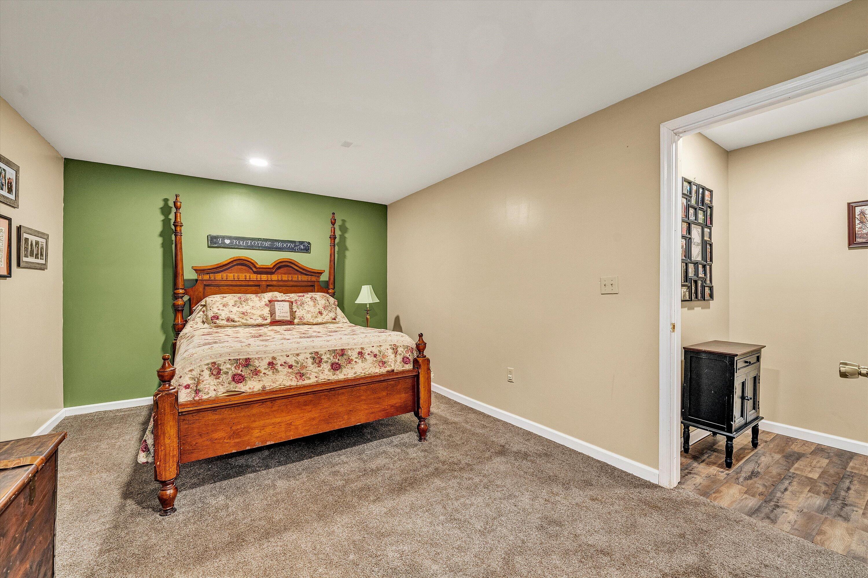 180 Thompson Ridge Circle Ferrum, VA 24088 - Photo 51 of 74 a bedroom with a bed and a window