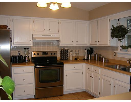 190 Mary Reed Road Economy, PA 15005 - Photo 4 of 18 Kitchen. Updated ss appliances, light fixtures, hardware, travertine flrs flow into dining rm. Convenient breakfast bar.