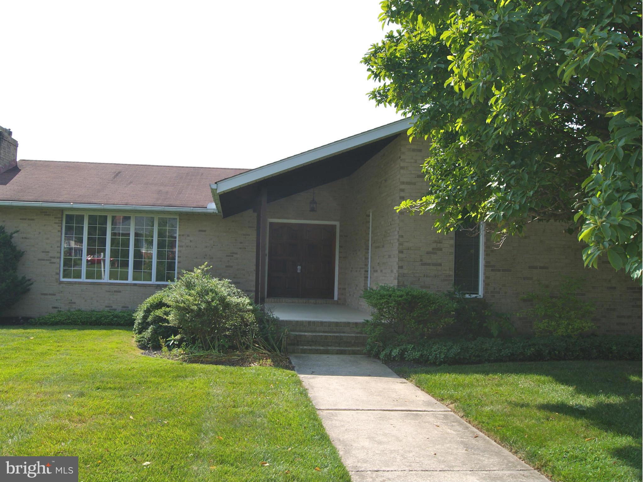 9221 Cornflower Road Baltimore, MD 21236 - Photo 2 of 25 a front view of a house with garden