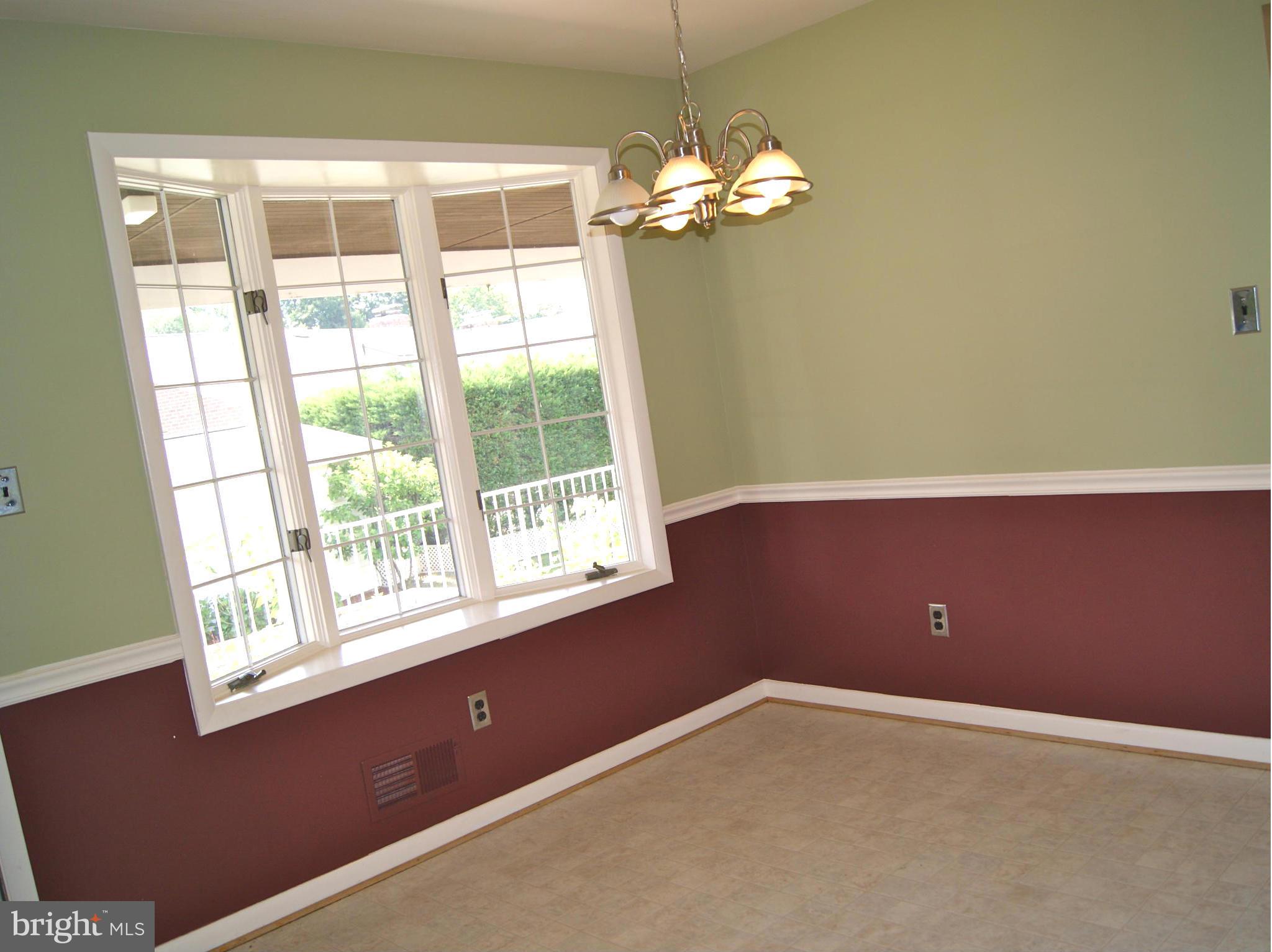 9221 Cornflower Road Baltimore, MD 21236 - Photo 13 of 25 a view of an empty room with a window