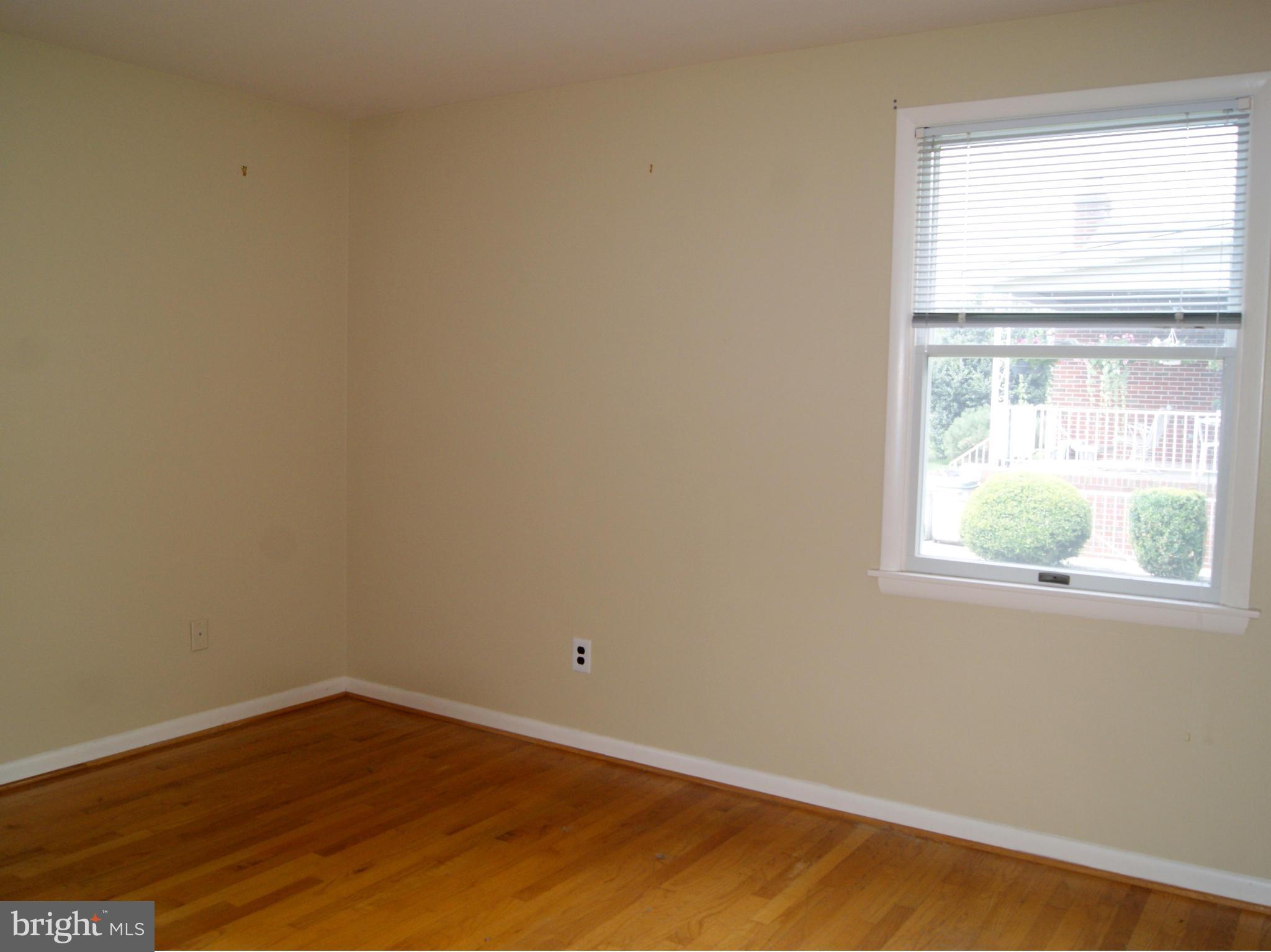 9221 Cornflower Road Baltimore, MD 21236 - Photo 17 of 25 an empty room with a window