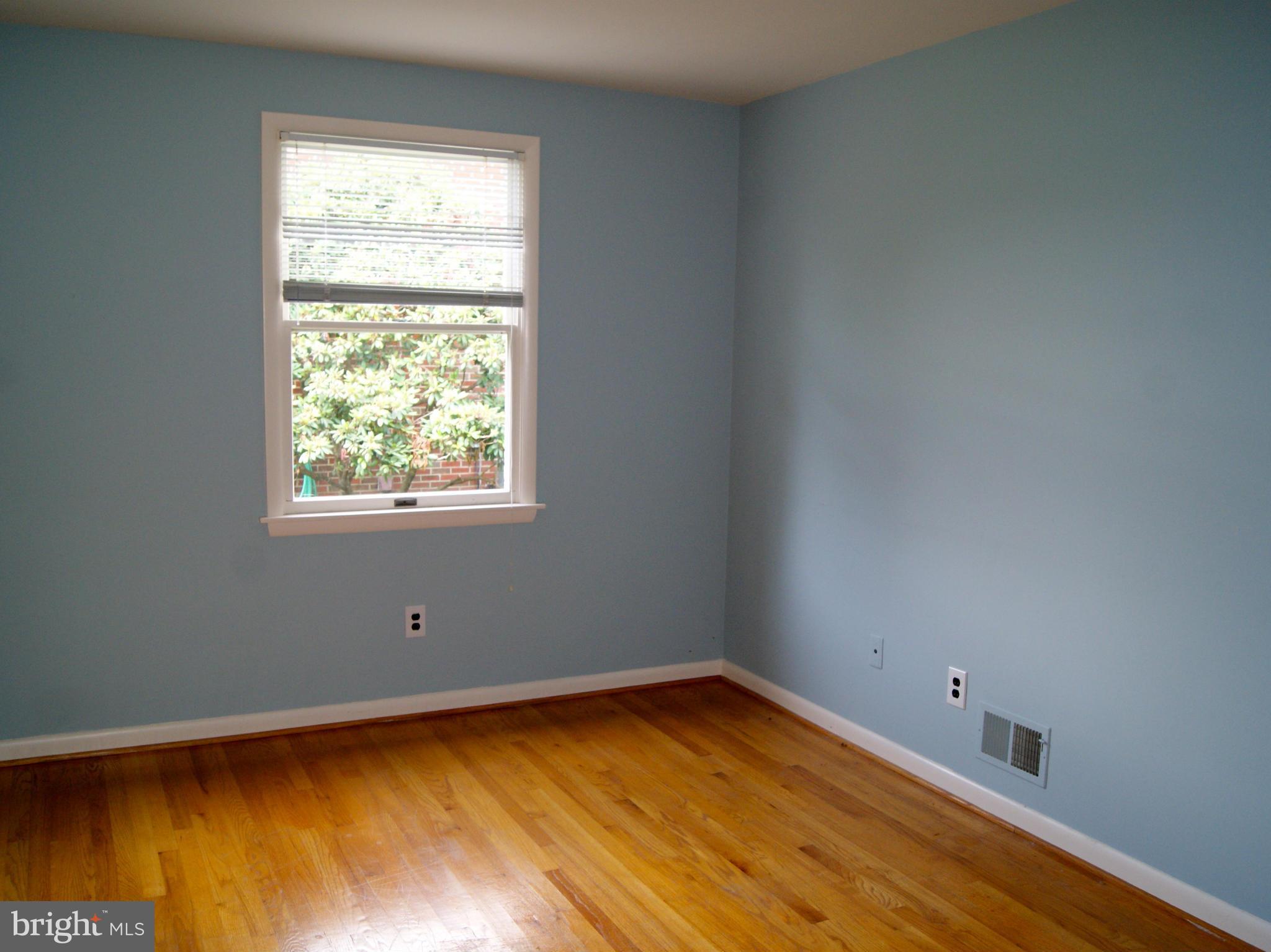 9221 Cornflower Road Baltimore, MD 21236 - Photo 18 of 25 a view of a room with wooden floor and a window