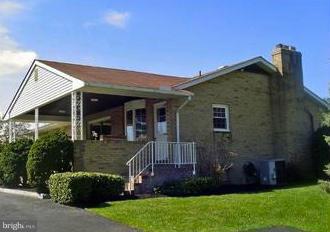 9221 Cornflower Road Baltimore, MD 21236 - Photo 5 of 25 front view of a house with a yard