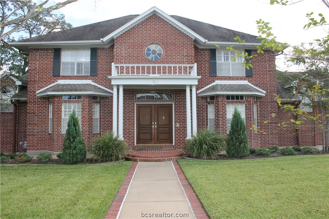 4311 Birchcrest Lane Bryan, TX 77802 - Photo 1 of 1 a front view of a house with garden