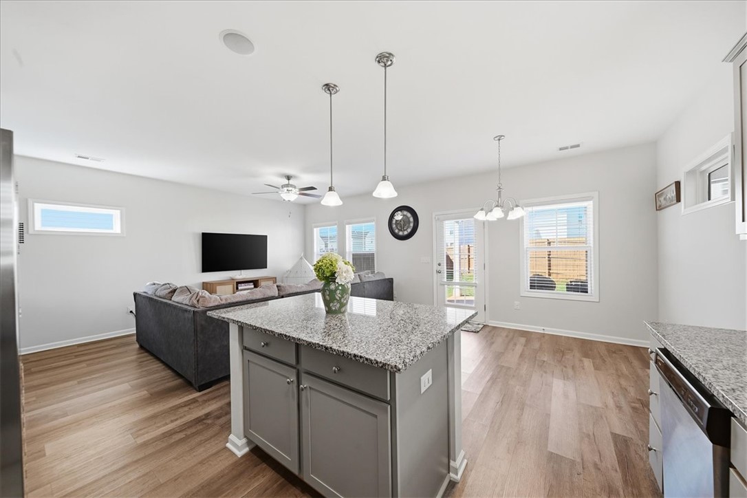 403 Seaborn Circle Pendleton, SC 29670 - Photo 15 of 47 This open-concept area showcases a functional kitchen island and direct outdoor access.
