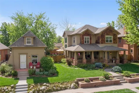 front view of brick house with a small yard